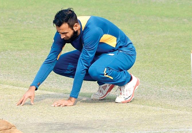 SA spinner Imran Tahir inspects the pitch at Mohali yesterday. Pic/AFP