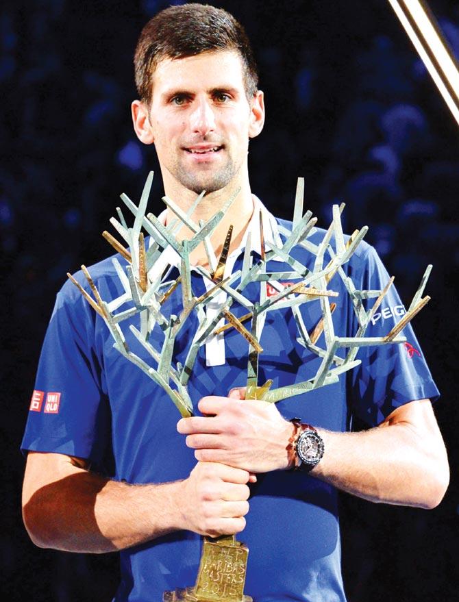Novak Djokovic with the trophy after winning the Paris Masters yesterday