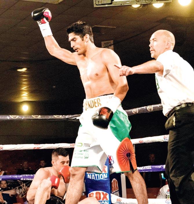 Vijender Singh knocks down Dean Gillen in Dublin on SaturdayVijender Singh knocks down Dean Gillen in Dublin on Saturday