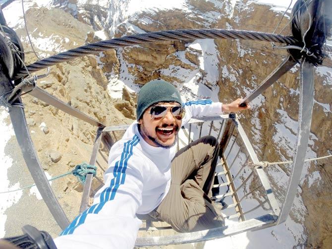 Arjun Menon on a ropeway that takes locals to and fro from Chichum Village in Spiti Valley, Himachal Pradesh
