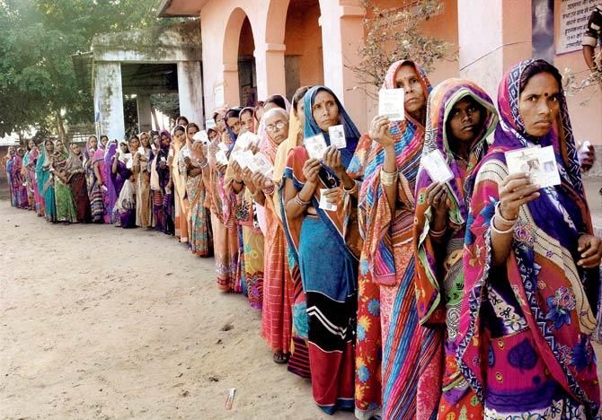 Women in Muzaffarpur wait in queue to cast their votes during the fourth phase of the Bihar elections yesterday. Pic/PTI