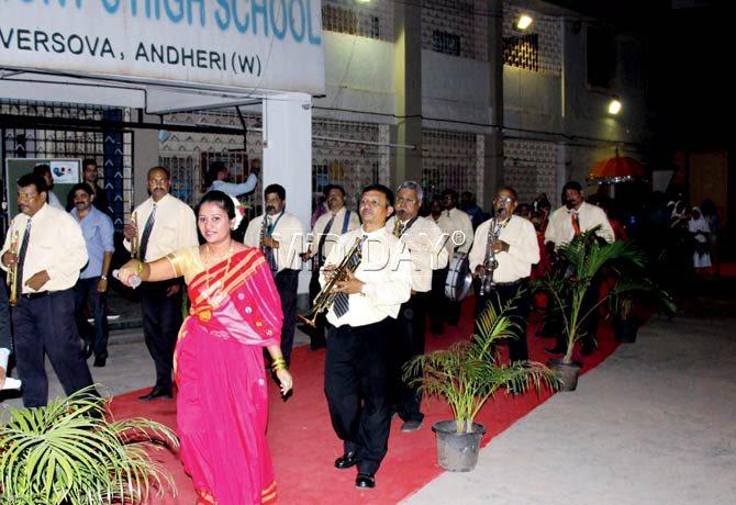 Evita Gonsalves from Versova village leads the band to the venue