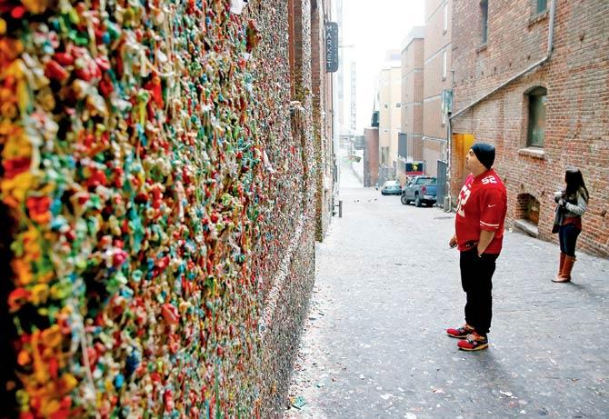 A fans looks at the Gum Wall. Pic/AFP