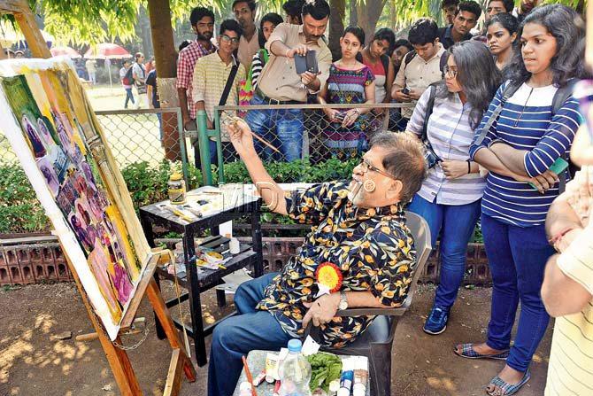 Painter Suhas Bahulkar gives finishing touches to his painting
