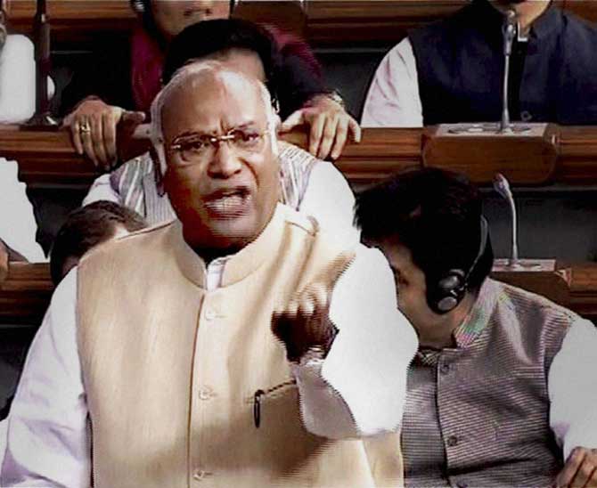 Congress Leader Mallikarjun Kharge speaks in the Lok Sabha during the first day of winter session of Parliament in New Delhi on Thursday.