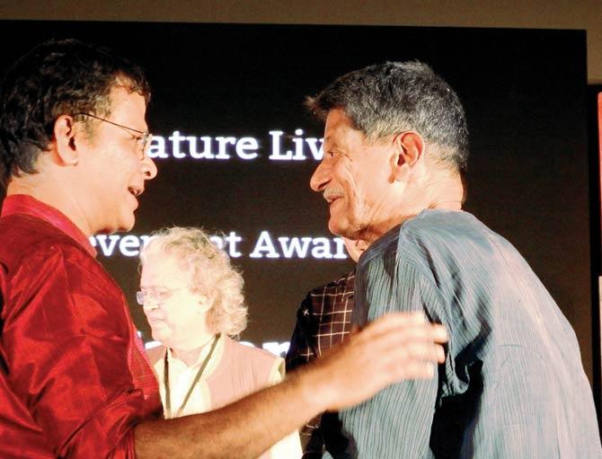 Author, poet and translator Jerry Pinto (left) congratulates Kiran Nagarkar (right), Tata Literature Live! festival director Anil Dharker is seen in the centre. Pic courtesy/Abodh Aras