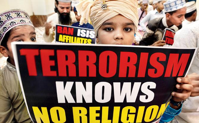 Muslims held rallies in many parts of world and spoke out against extremism braving personal risk. Young students in Mumbai also gathered to denounce ISIS on November 20. Pic/AFP 