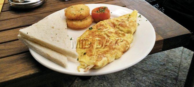 Sausage Omelette served with white bread, potato cutlets at the Beer Café. PICS/HASSAN M KAMAL