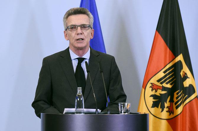 German Interior Minister Thomas de Maiziere addresses the press at the Interior ministry in Berlin on November 14, 2015, a day after deadly attacks in Paris. AFP PHOTO / TOBIAS SCHWARZ