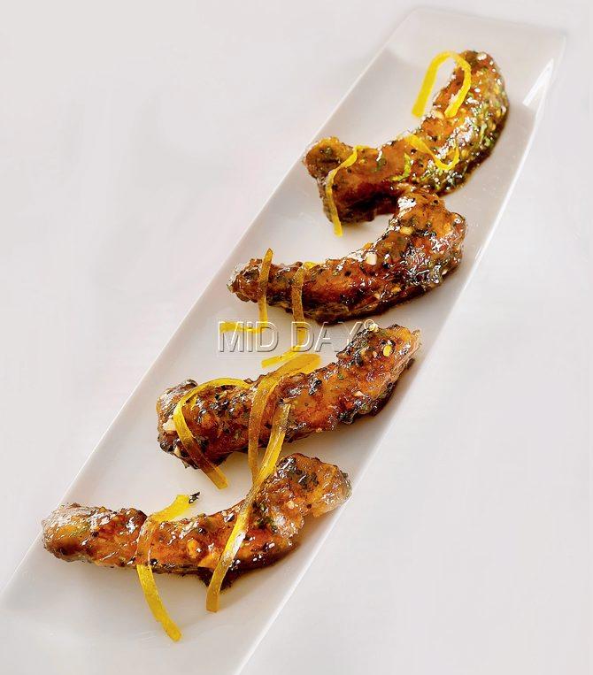 A contemporary Indian take on the sweet-and-sour BBQ, chef Manish Mehrotra’s meetha achaar Canadian spare ribs come with a sun-dried mango glaze and toasted kalonji fennel seeds.  PIC/AMIT PASRICHA