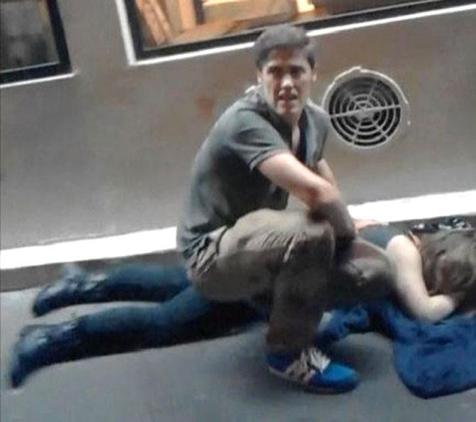 This video grab taken from a mobile phone on November 13, 2015, shows wounded people outside Bataclan music hall in Paris