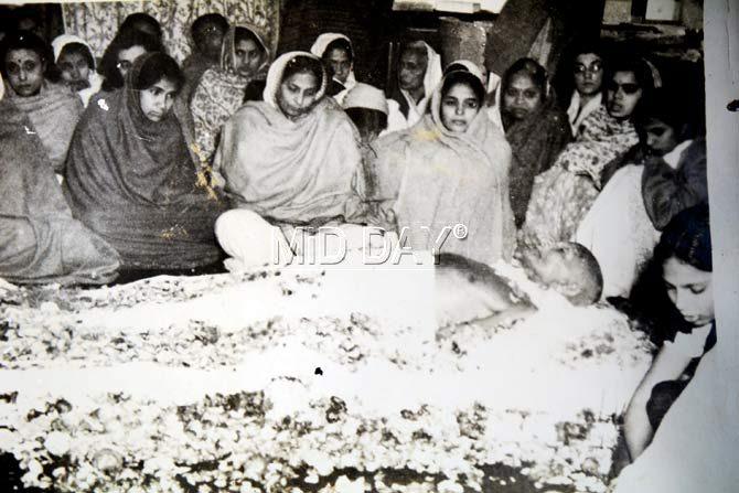 THE LIGHT: has gone out of our lives. A photograph at Sarla Mehta’s home in Andheri showing mourners around  Bapu’s body