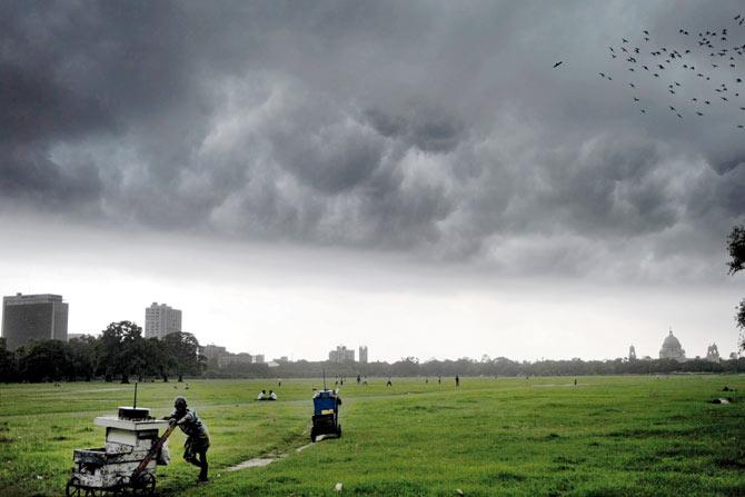 Monsoon clouds loom overhead in Kolkata in August. The annual monsoon lunch in the US, a place where it does not rain and from where their children cannot even begin to imagine the incessant downpour that drenches Kolkata every year,  helps them retain their ‘Bong’ connection. Pic for Representation/AFP