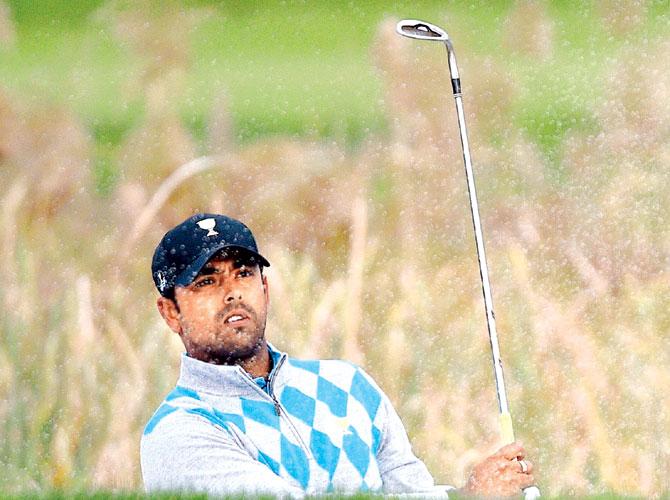 Anirban Lahiri looks at his bunker shot on the 11th hole of fourball matches at the Presidents Cup in Incheon on Saturday. Pic/AFP