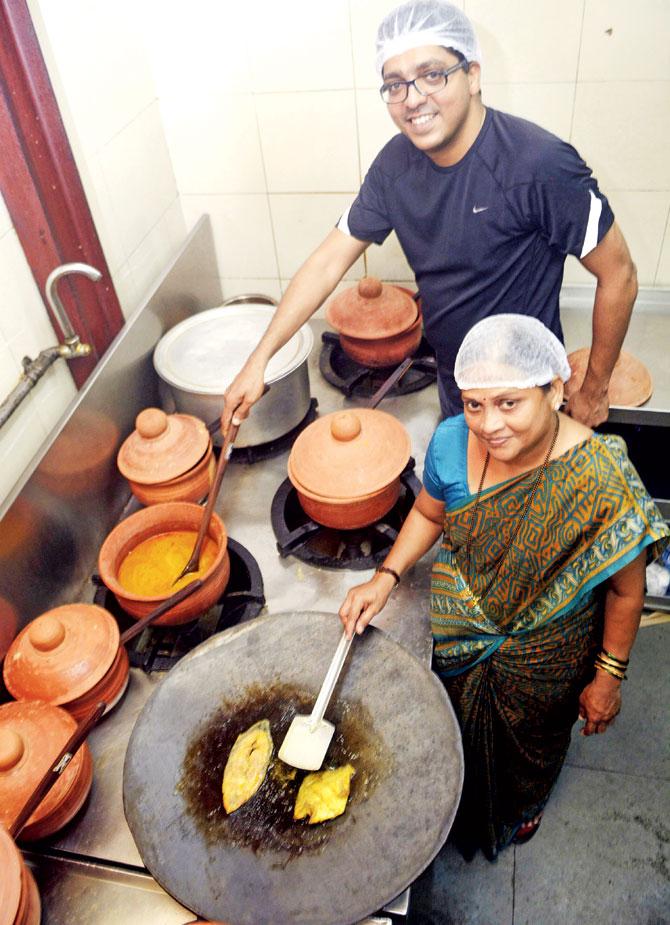 Chef Kavita Patil and co-owner Hari Kotian at the Aagri Culture Express kitchen. The food is true to tradition and cooked on low flame in clay pots