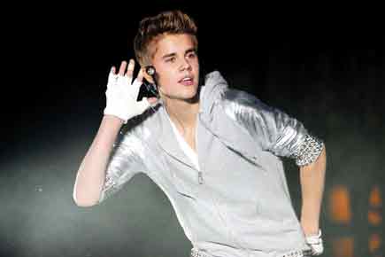Justin Bieber threatens legal action over nude photos