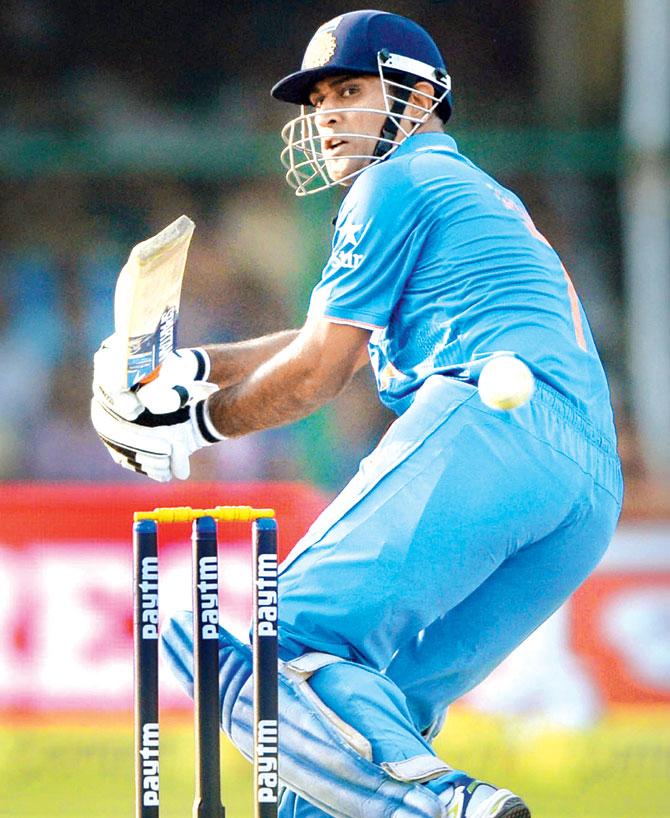 India captain MS Dhoni plays one en route his 30-ball 31 in Kanpur yesterday. Pic/PTI