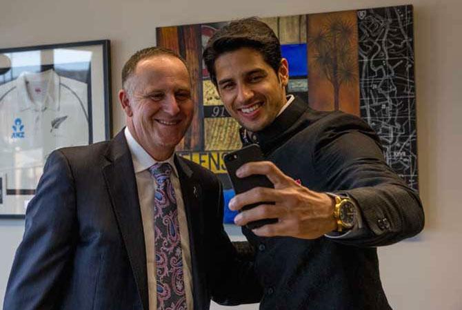 Sidharth Malhotra takes a selfie with New Zealand Prime Minister John Key