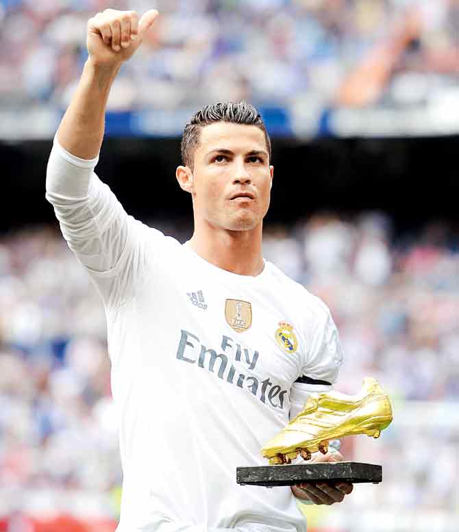 Cristiano Ronaldo with his Golden Shoe award at the La Liga match on Saturday. Pic/Getty Images