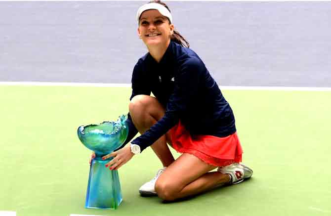 Agnieszka Radwanska of Poland poses with her trophy after winning the women