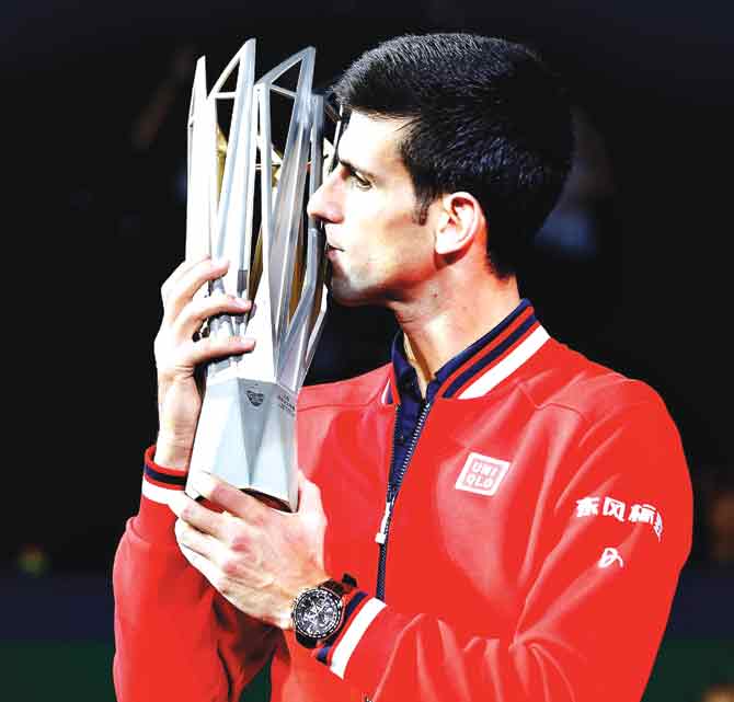 Novak Djokovic poses with the winner