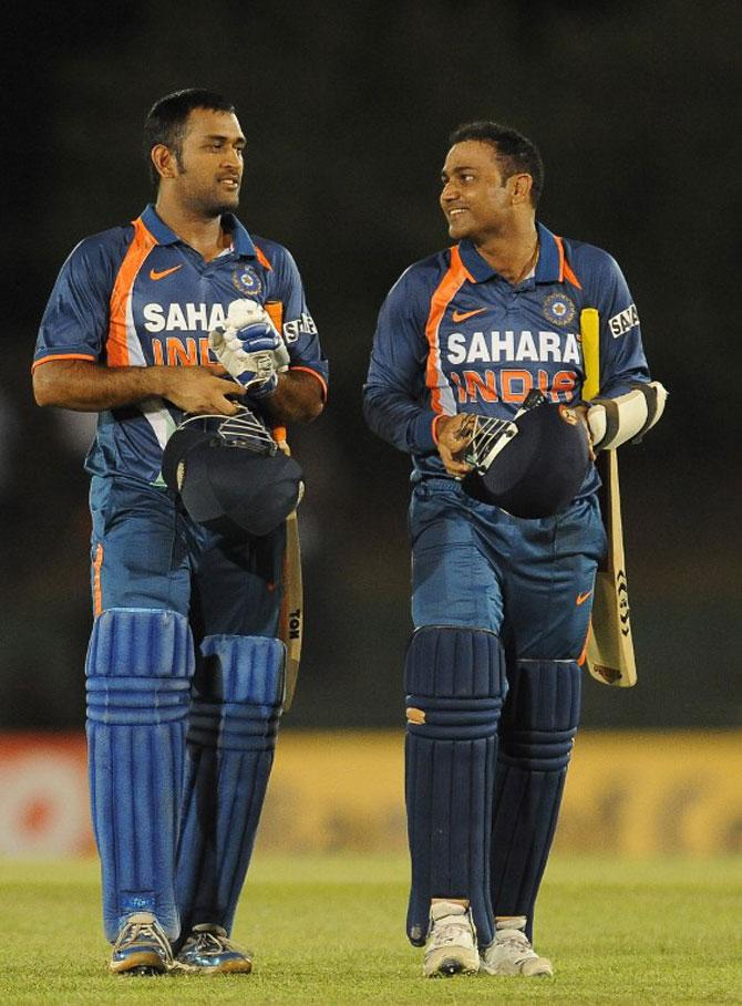MS Dhoni and Virender Sehwag. File Pic/AFP