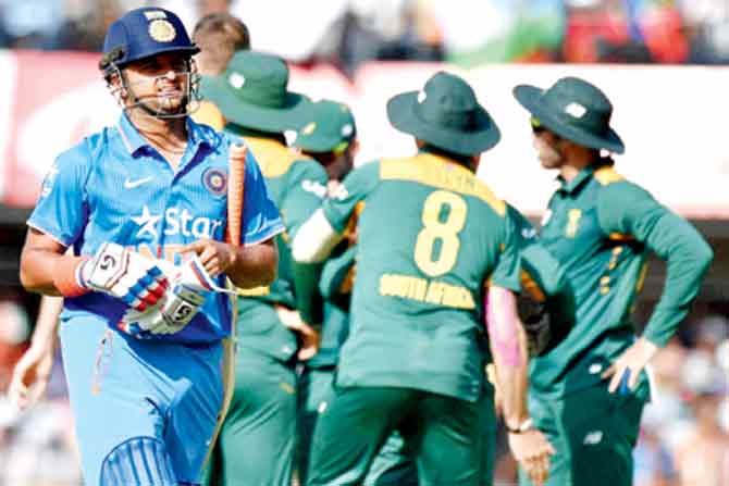Suresh Raina walks back to the pavilion after being dismissed for a duck during the second ODI against South Africa at the Holkar Cricket Stadium in Indore last week. Pic/PTI