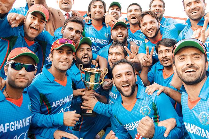 Afghanistan players celebrate their series win over  Zimbabwe on Saturday. Pic/AFP