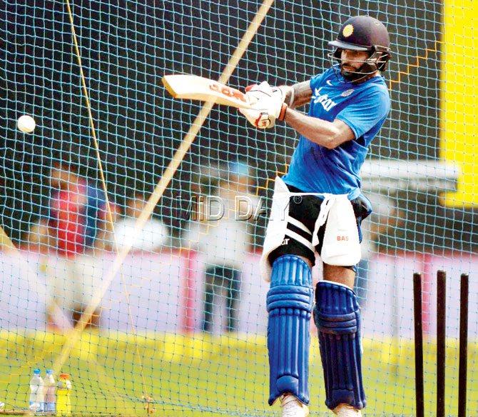 India opener Shikhar Dhawan plays a horizontal bat shot in the nets on Saturday. Pics/Atul Kamble