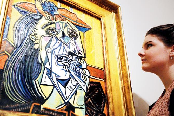 The Weeping Woman, a 1937 painting by Picasso, on display at the Tate gallery in 2012. Depicting a singular image of universal suffering, the painting carries forward anti-war theme that Picasso portrayed in Guernica. Pic/AFP