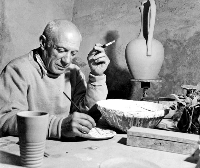 Pablo Picasso applies himself to a project of ceramics in his workshop in Vallauris April 1949. Pic/Getty Images