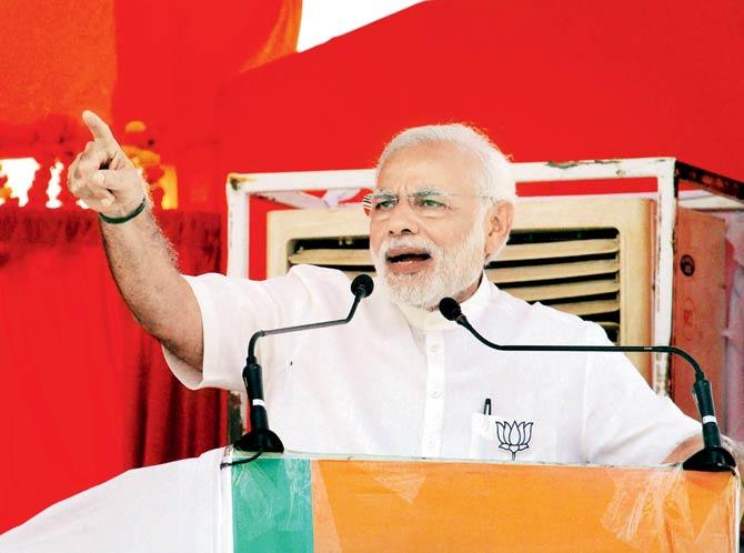 During an election rally in Buxar on Monday, PM Narendra Modi said the BJP was fighting those who wished to take away reservation from backward castes and hand them to a “particular community”. Pic/PTI