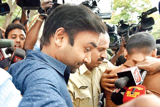 Amit Mishra comes out of Cubbon Park police station in Bangalore after he was granted bail. Pic/PTI
