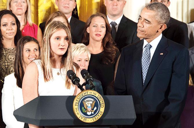 Abby Forrest (left), a 11-year-old, who wrote a letter to US President Barack Obama (right) on the importance of women