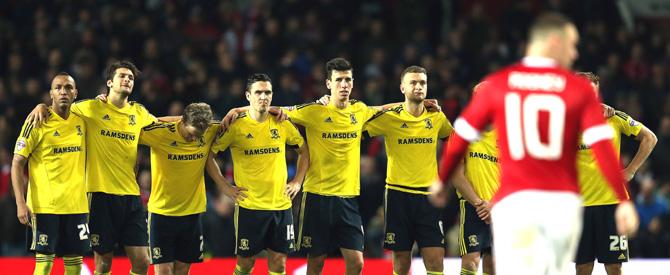 Middlesbrough players stand together as Wayne Rooney walks back after missing his penalty in the shoot-out during the English League Cup fourth round football match between Manchester United and Middlesbrough at Old Trafford in Manchester. Pic/AFP