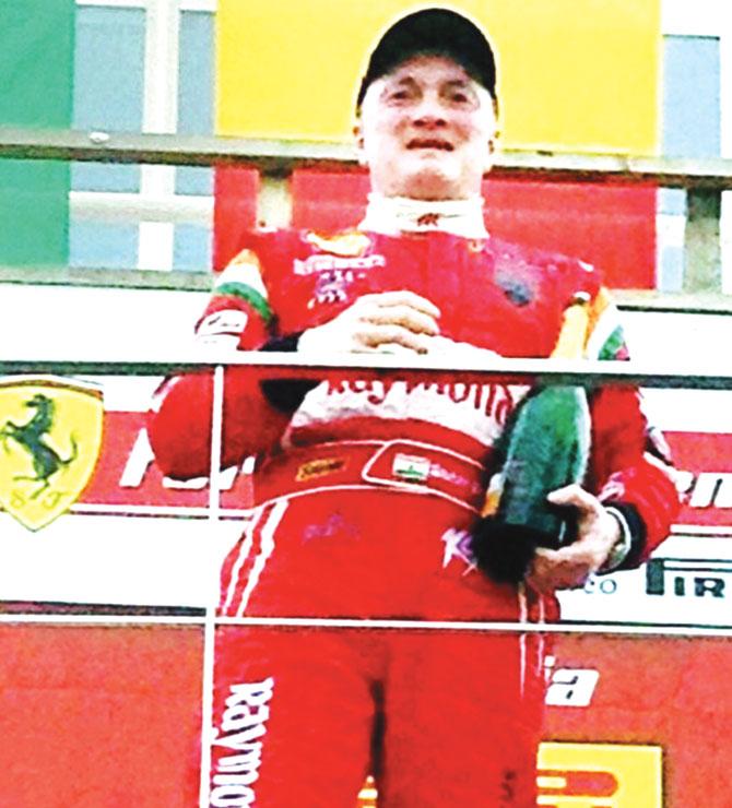 Industrialist Gautam Hari Singhania atop the podium after he finished second in Race 1 of the Coppa Shell category in the Ferrari Challenge Europe Championship 2015 on Saturday. Pic/ PTI