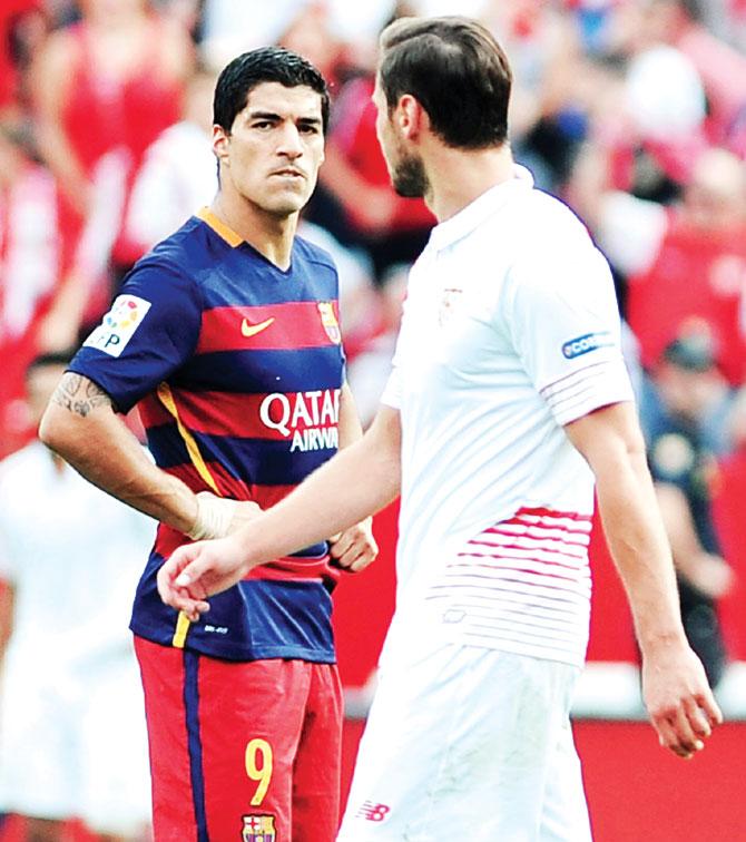 A disappointed Barca striker Luis Suarez looks on after a Sevilla goal. Pic/AFP