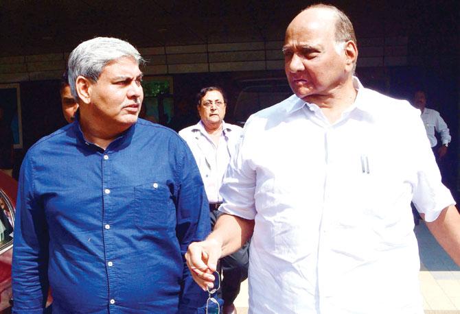 Shashank Manohar with Sharad Pawar at the BCCI headquarters in Mumbai on Saturday. Pic/AFP