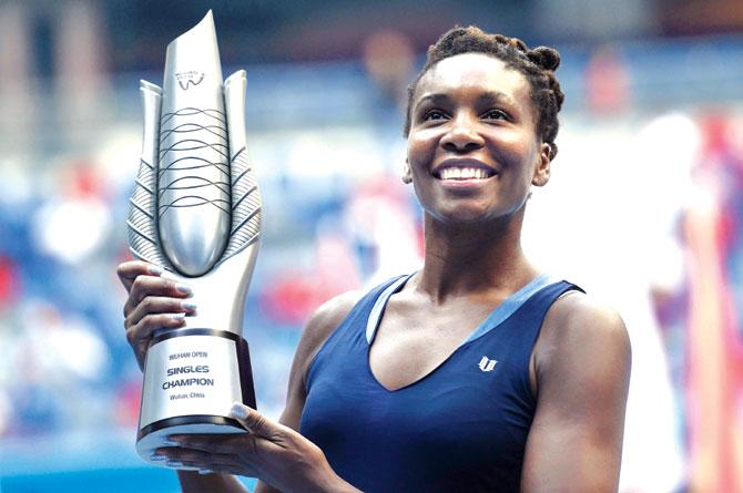 American Venus Williams poses with her Wuhan Open women