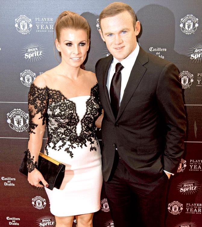 Wayne Rooney & wife Coleen. Pic/AFP