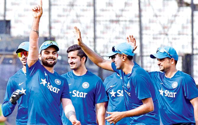 Virat Kohli (second from left) shares a light moment with teammates during a practice session at the Eden Gardens in Kolkata yesterday. Pics/PTI