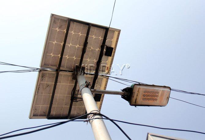 A solar panel on the streetlight
