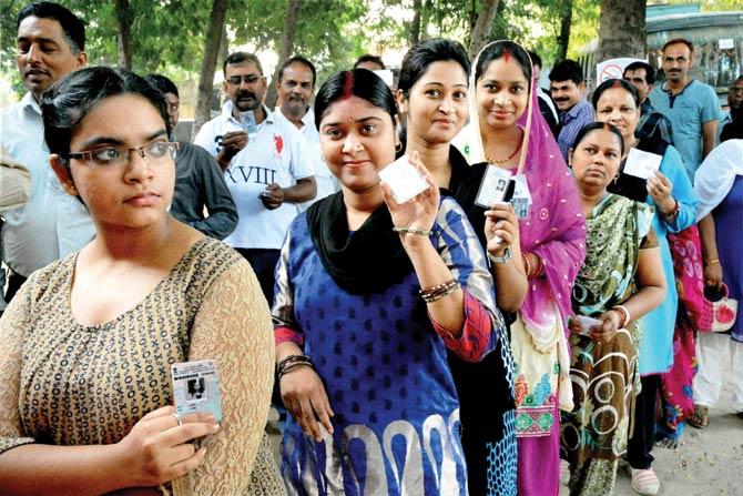 Voters wait to cast their vote in Bihar. Markets hope to do better once the atmosphere is conducive in the aftermath of poll results when Parliament is likely to pass pending bills. Pic/PTI
