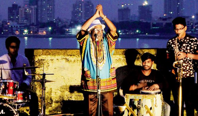 Presented  by Zubaan, (centre) Koli singer Chintamani performing with (from left) Jignesh on drums, Dinu on percussions and Sylvester, from Worli Koliwada’s Astik Brass Band, at Worli Fort earlier this month