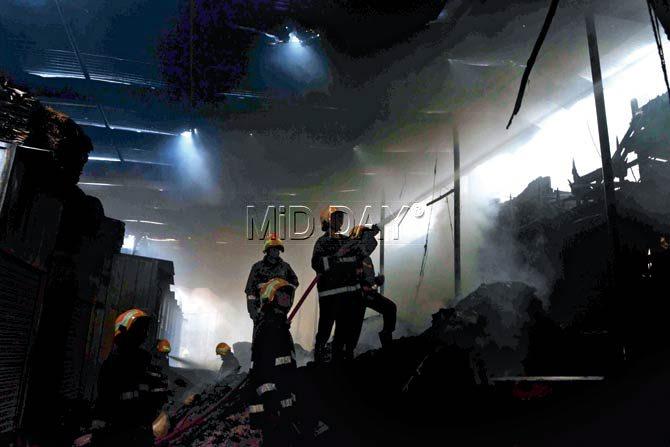 Firefighters douse the blaze