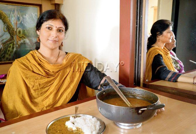 Geeta Akolia offers bhatt ki churkani made of black soyabeans. She asks  family members coming from her village, Gagur, to bring her ingredients specific to the Kumaon region. pic/pratik chorge