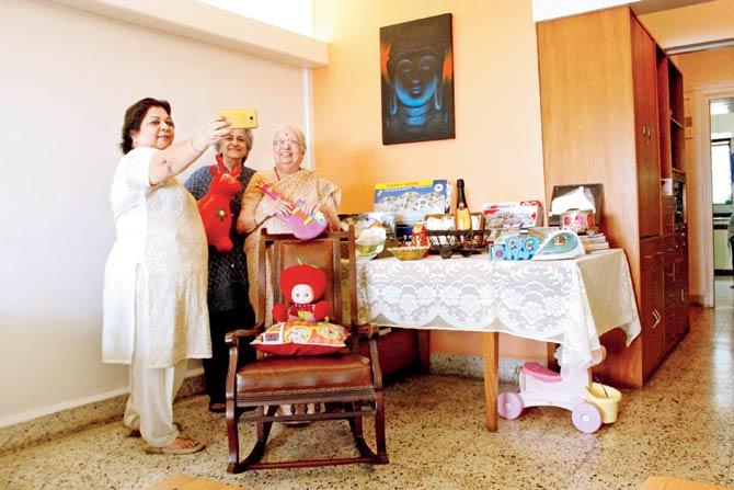 (Far right) Heena Udeshi readies for the Masonic garage sale. Pic/Tushar Satam