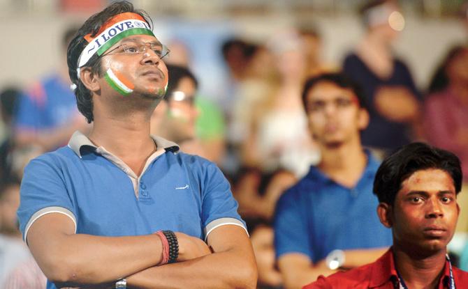 Indian fans are dejected after the match was abandoned due wet weather at Eden Gardens in Kolkata yesterday. PIC/AFP