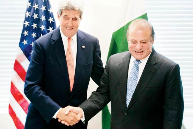 US Secretary of State John Kerry (left) with Pakistan PM Nawaz Sharif at the United Nations headquarters on September 27. Emerging Sino-Pak alliance is one of the factors that has motivated the US to offer Islamabad the hand of friendship, which Pak has been seeking from the time of the Indo-US nuclear deal. Pic/AFP