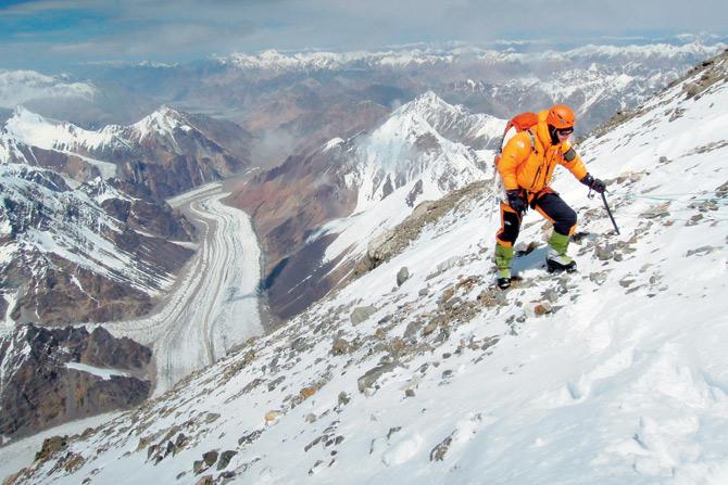 An expedition member climbs a ridge on the north slope of K2 from China. In comparison to Mount Everest, K2 is seen as the world’s toughest and most dangerous mountain, with one death for every four successful ascents. PIC/GETTY IMAGES